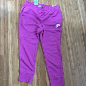 New with tags,pink XL kids Nike sweats.